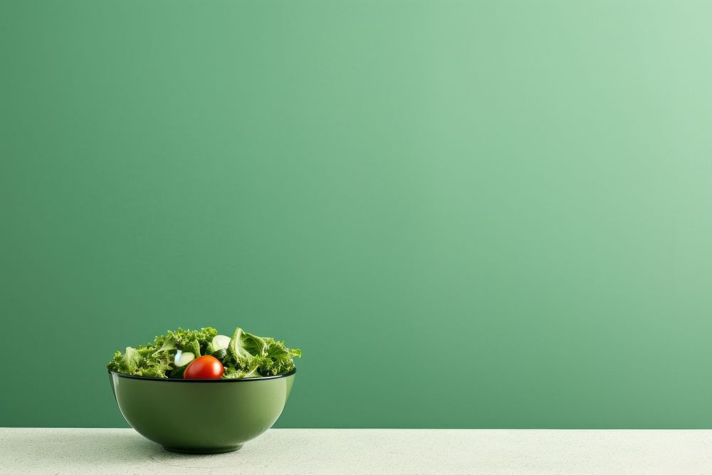  A salad bowl border on green paper background vegetable plant food. AI generated Image by rawpixel.