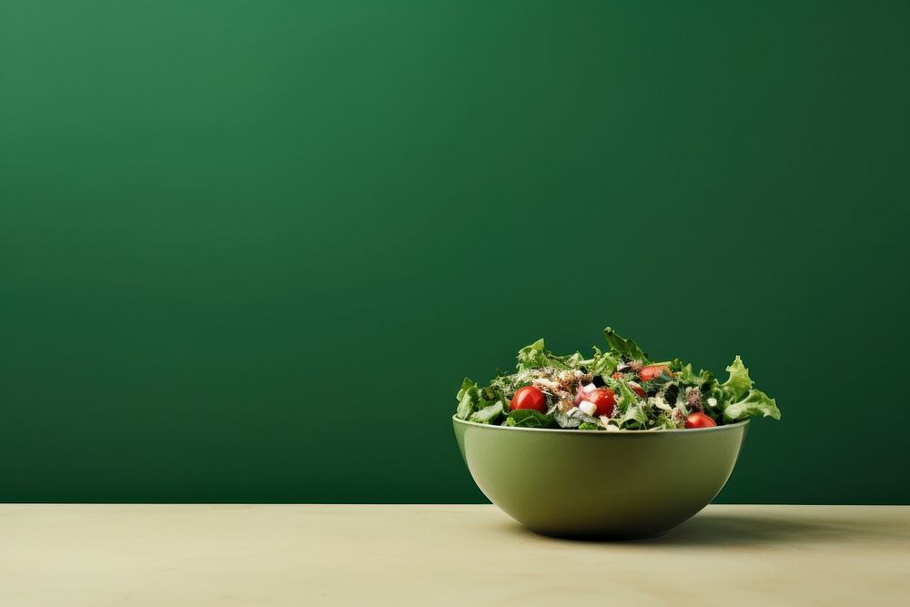  A salad bowl border on green paper background vegetable plant food. AI generated Image by rawpixel.