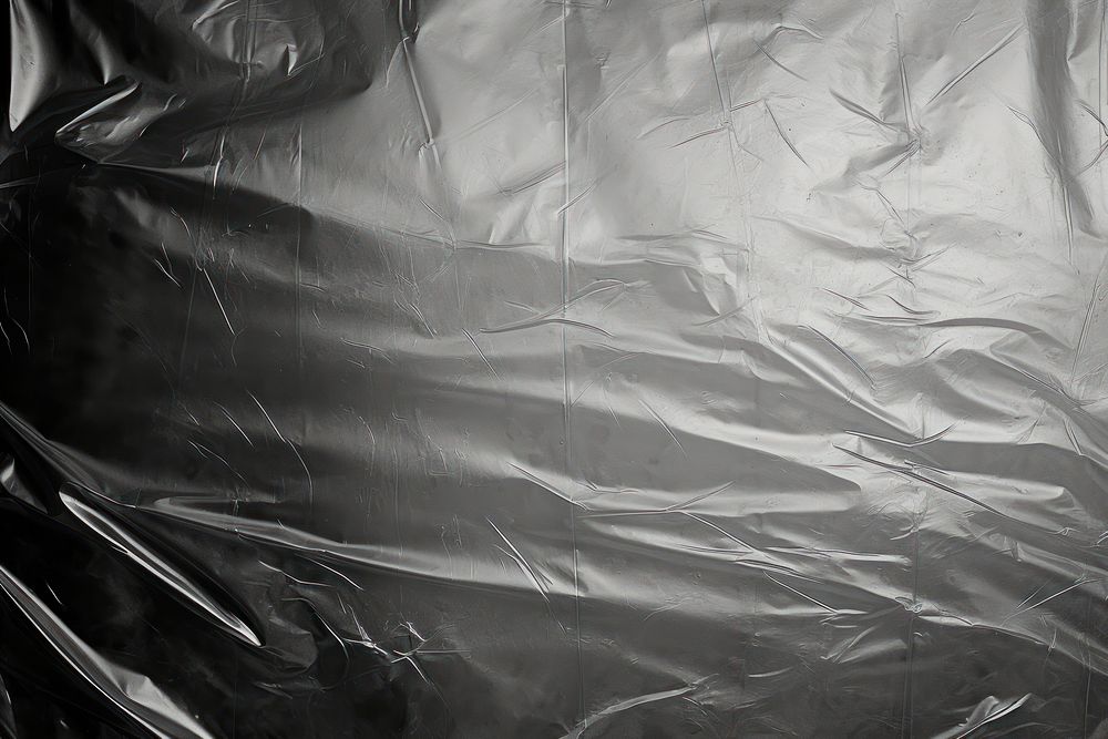 Cling plastic wrap over black background backgrounds accessories monochrome.