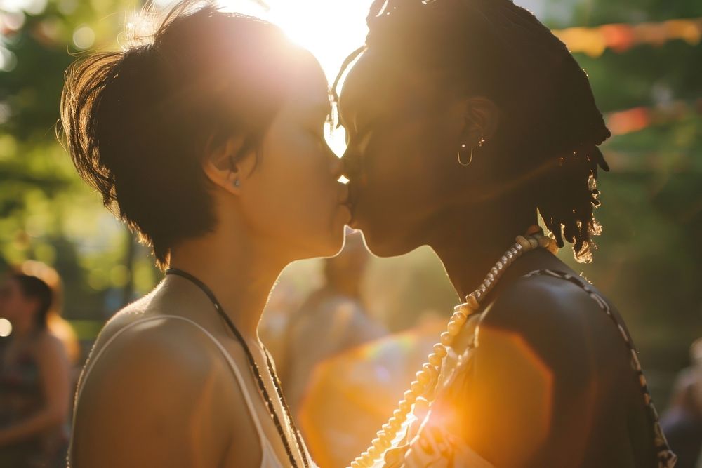  Black women and asian woman kissing portrait necklace wedding. AI generated Image by rawpixel.