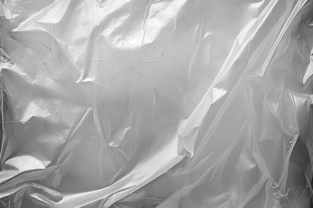 Plastic wrap backgrounds monochrome aluminium.