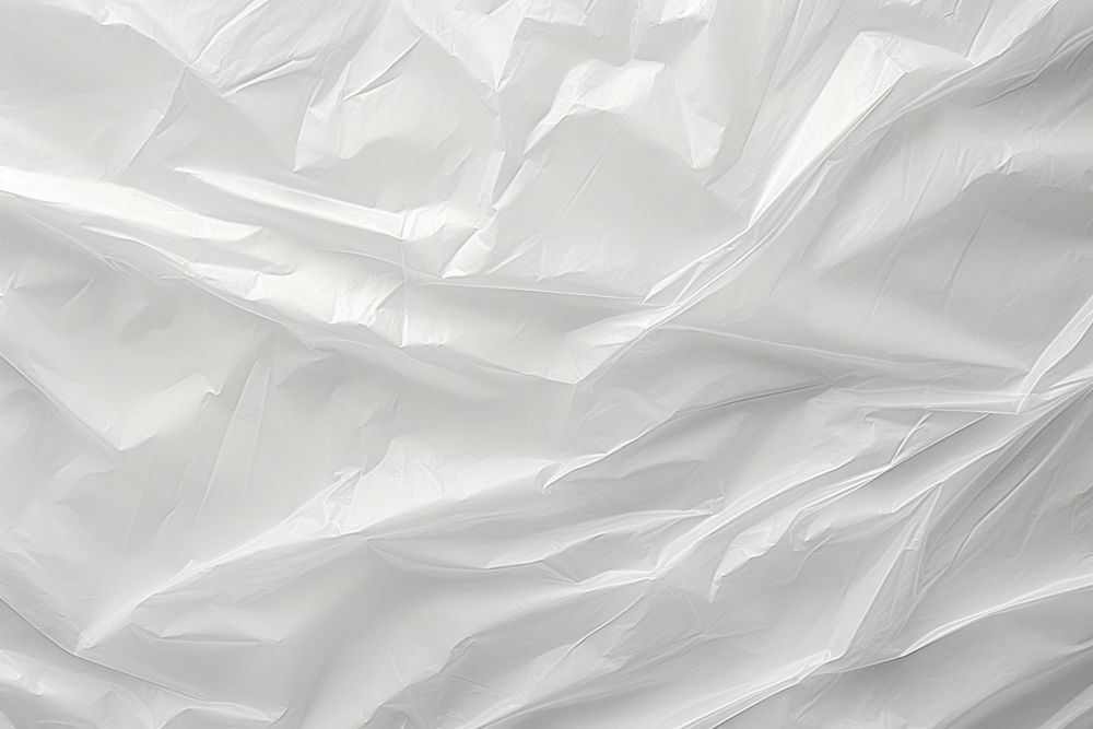Plastic wrap backgrounds wrinkled white.