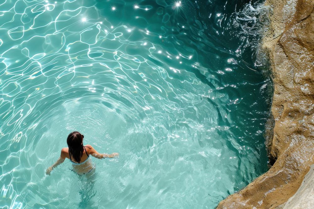 Woman in icebergs pool in australia swimming outdoors swimwear.