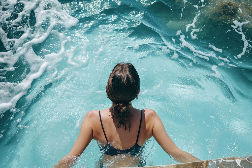 Woman in icebergs pool in australia swimming swimwear outdoors.