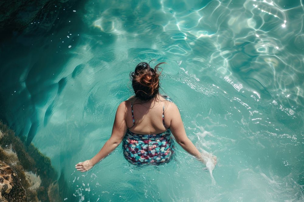 Chubby woman in icebergs pool in australia swimming swimwear portrait.