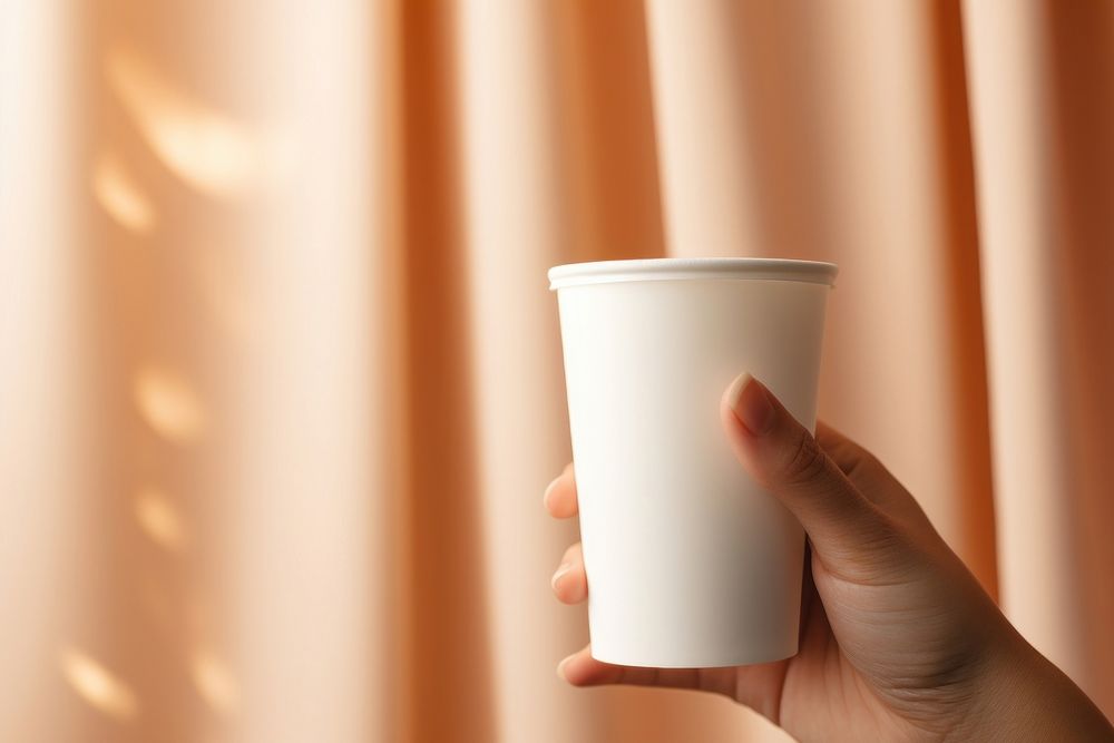 Coffee cup  holding hand mug.