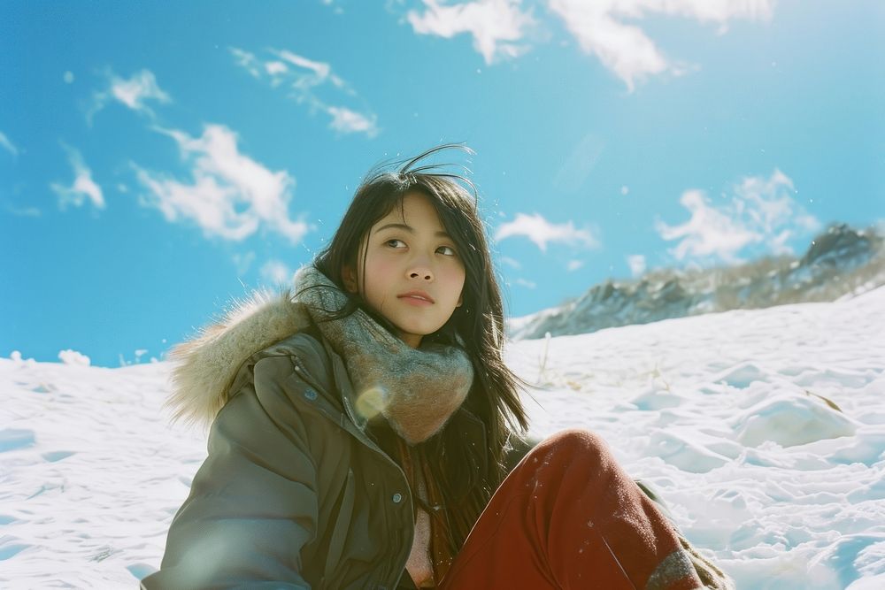 Korean woman snow portrait outdoors.