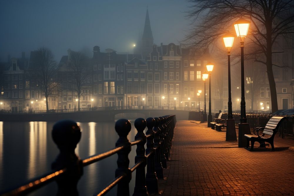 A foggy day architecture illuminated cityscape.