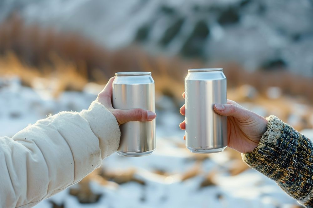 Stainless can  landscape holding hand.