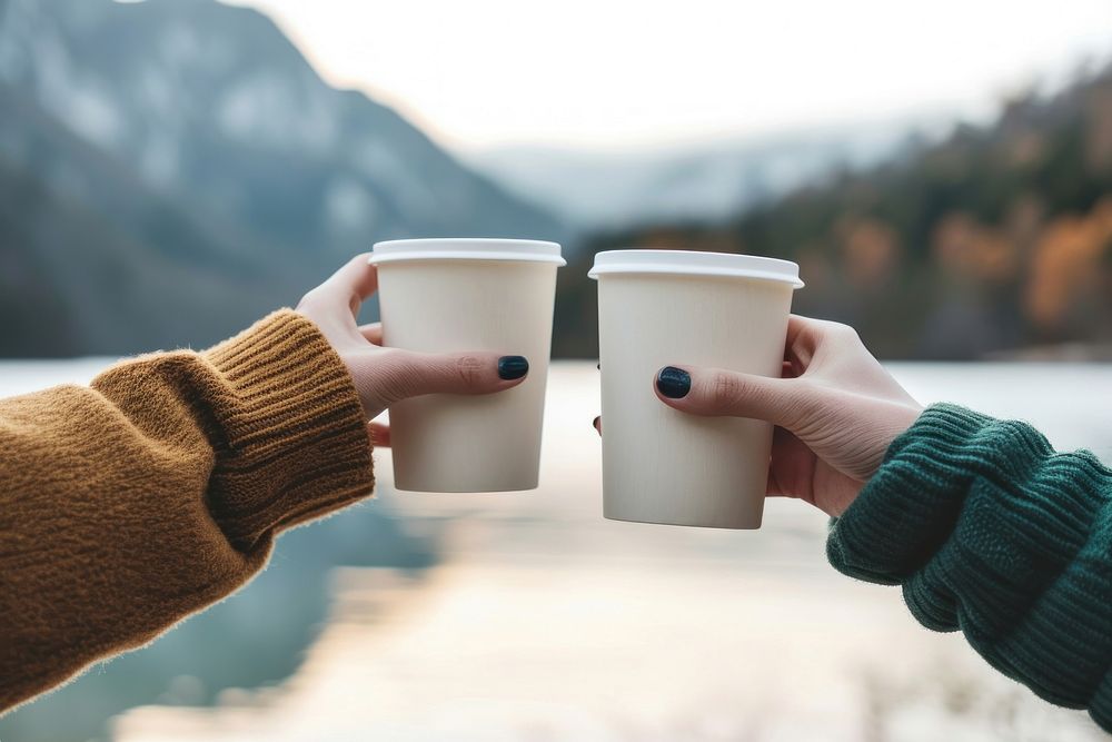 Coffee cup  hand holding drink.