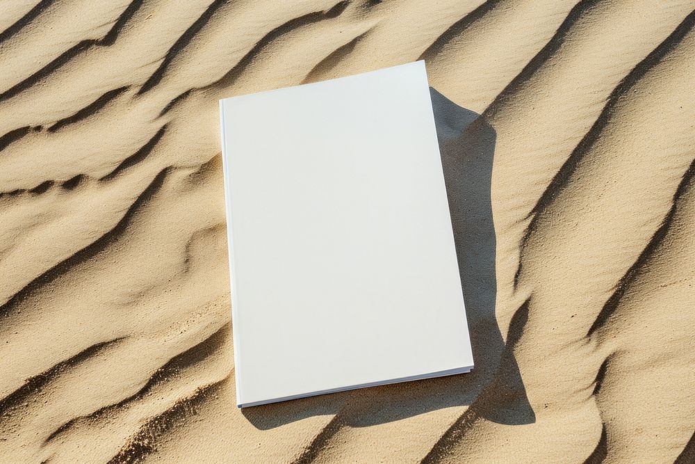 Cover magazine  sand outdoors sunlight.