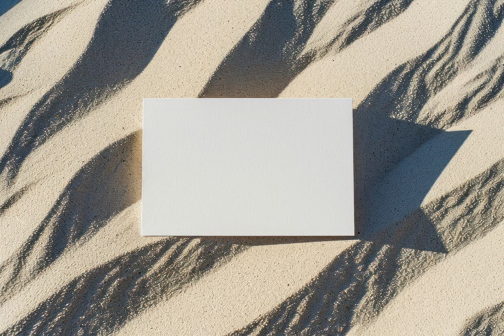 Business card  sand backgrounds outdoors.