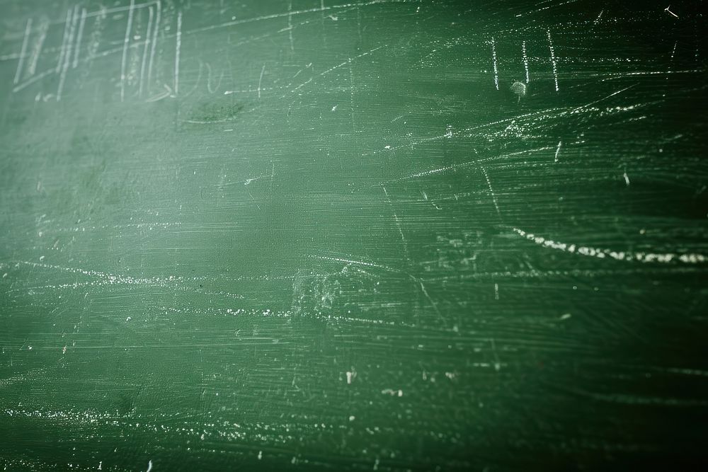 Chalk rubbed out on green chalkboard blackboard mathematics backgrounds.