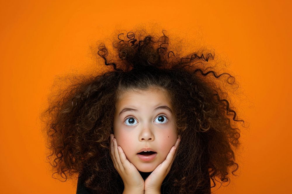 Surprised young girl with Big Hair photography surprised portrait.