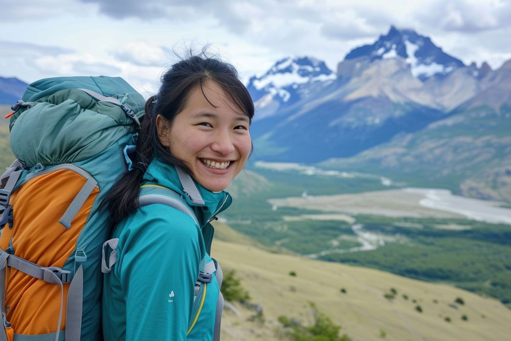 Vietnamese woman hiking patagonia backpacking mountaineering exploration.