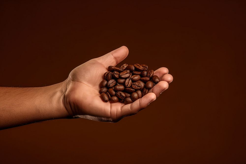 Coffee holding brown hand.