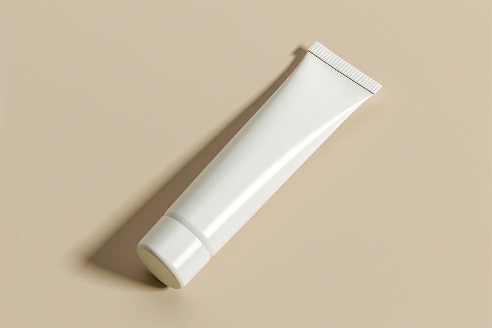Tube  toothpaste bottle colored background.