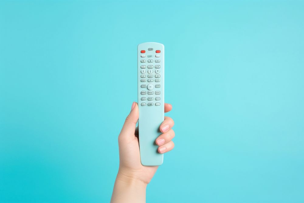 hand holding remote control electronics | Free Photo - rawpixel