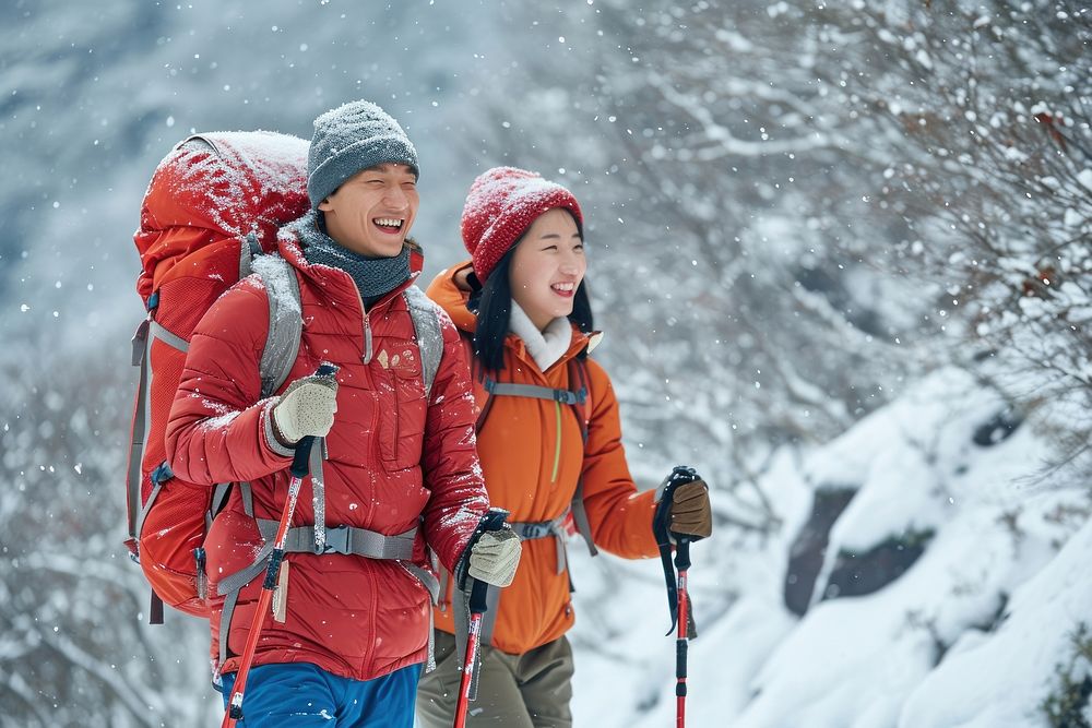 Asian couple hiking Everest snow recreation adventure.