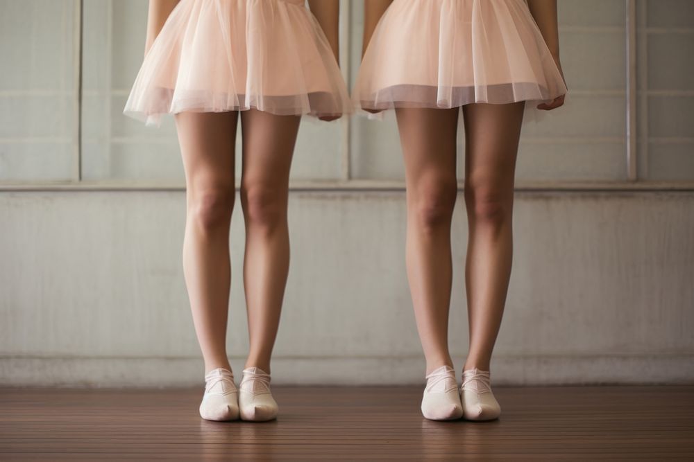 Ballet girls legs standing in ballet shoes dancing skirt recreation.