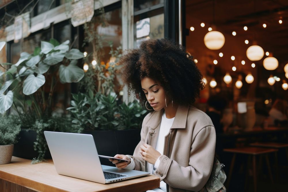 Black woman uses laptop computer adult concentration.