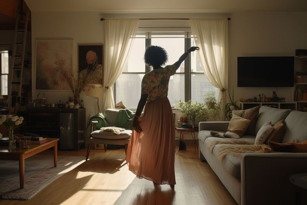 Black woman dances in the living room architecture furniture building.