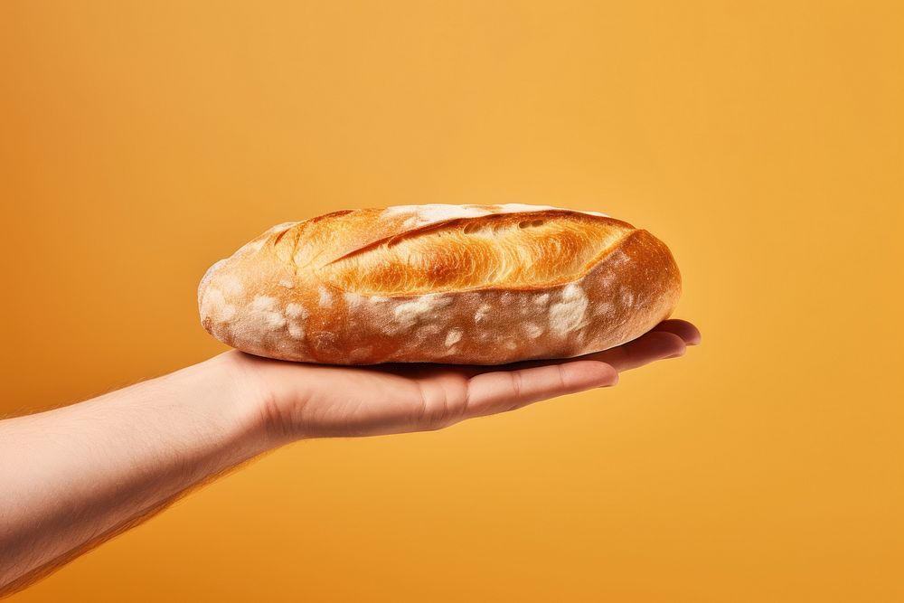 Bread loaf on hand holding food sourdough.