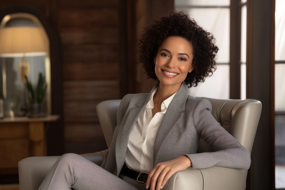Business woman sitting and holding tablet smiling adult smile.