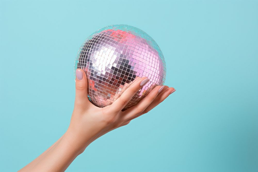 Disco ball on hand holding sphere celebration.