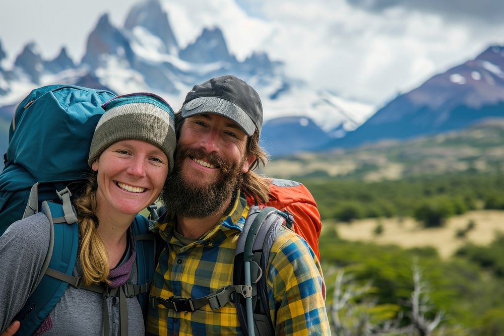 Happy couple hiking patagonia backpacking adventure outdoors.