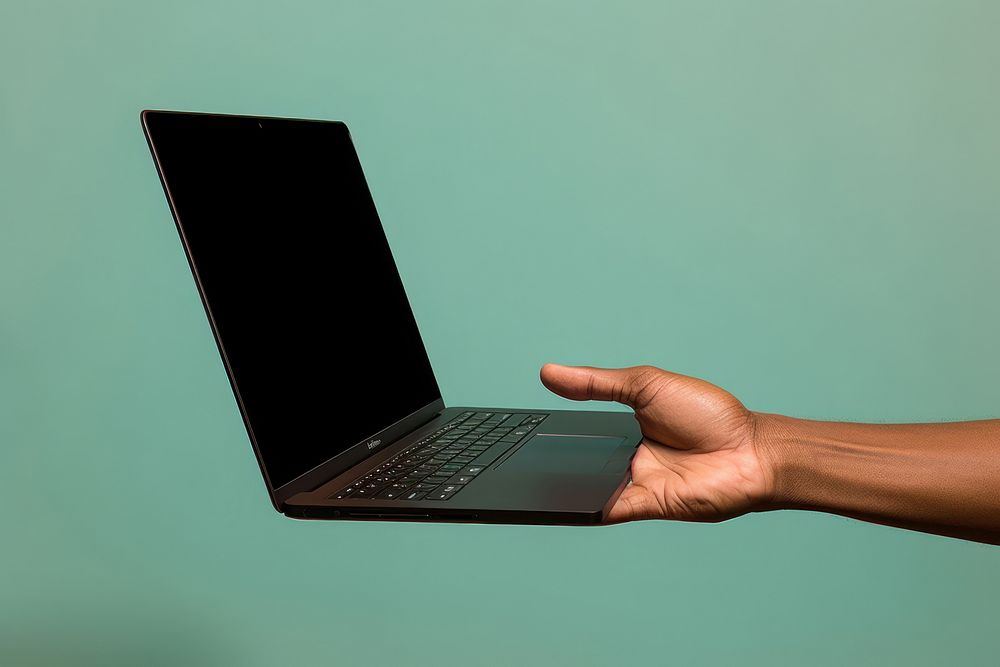 Laptop on hand computer portability electronics.