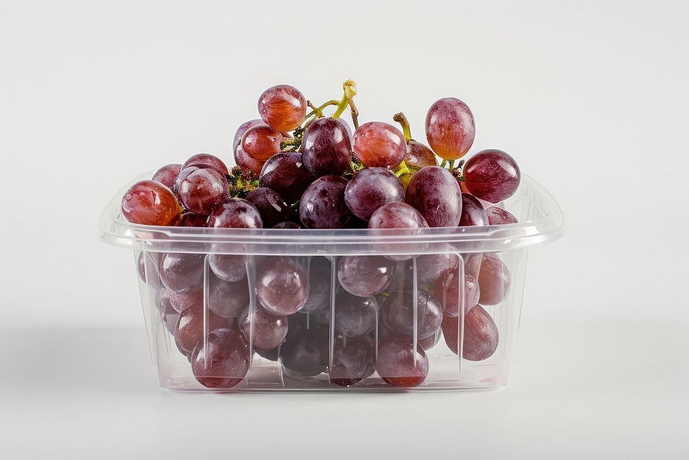 Red grape in the Transparent container  grapes fruit plant.