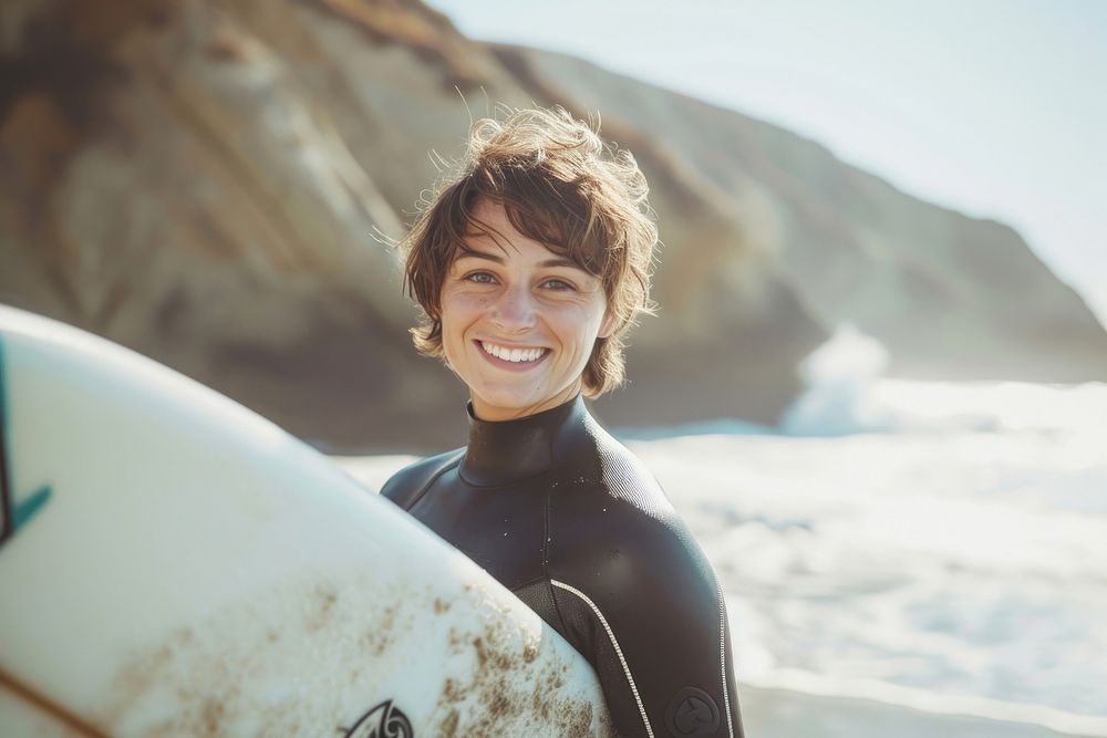 Wetsuit outdoors smile surfboard.