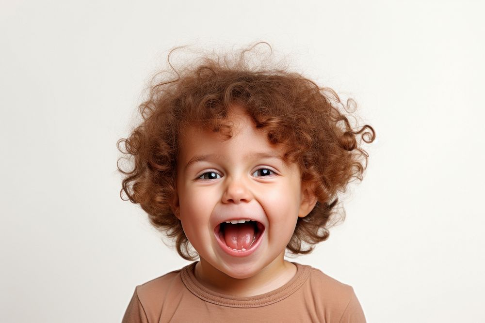 Child making funny faces shouting baby white background.