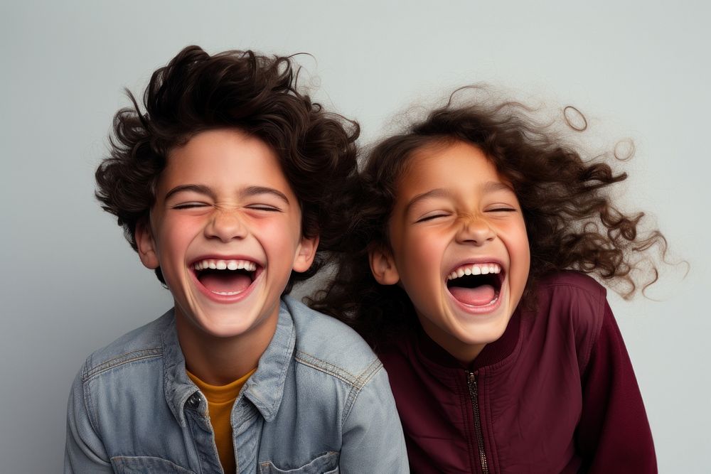 Young boy and girl laughing child togetherness friendship.