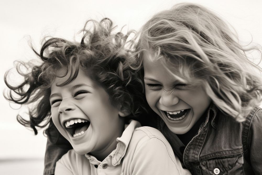 Young boy and girl laughing portrait child teeth.