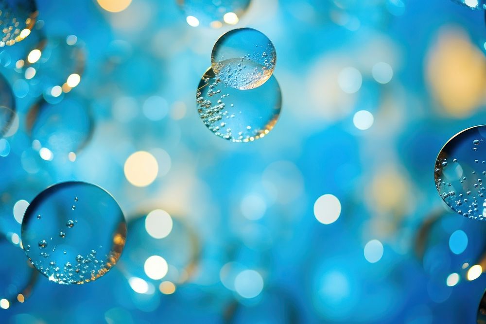 Bubbles shape pattern in bokeh effect background backgrounds sphere blue.