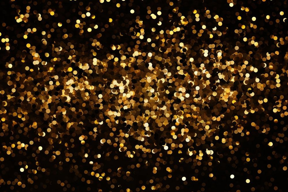 Golden confetti pattern in bokeh effect background backgrounds lighting outdoors.