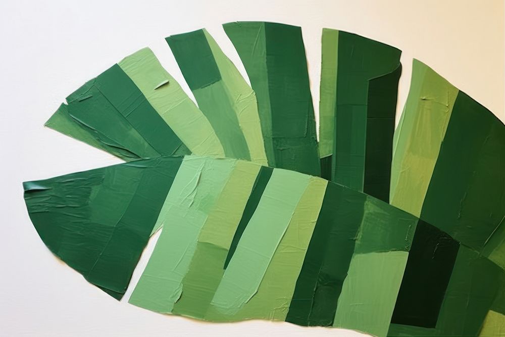 Abstract palm leaf ripped paper art collage plant.