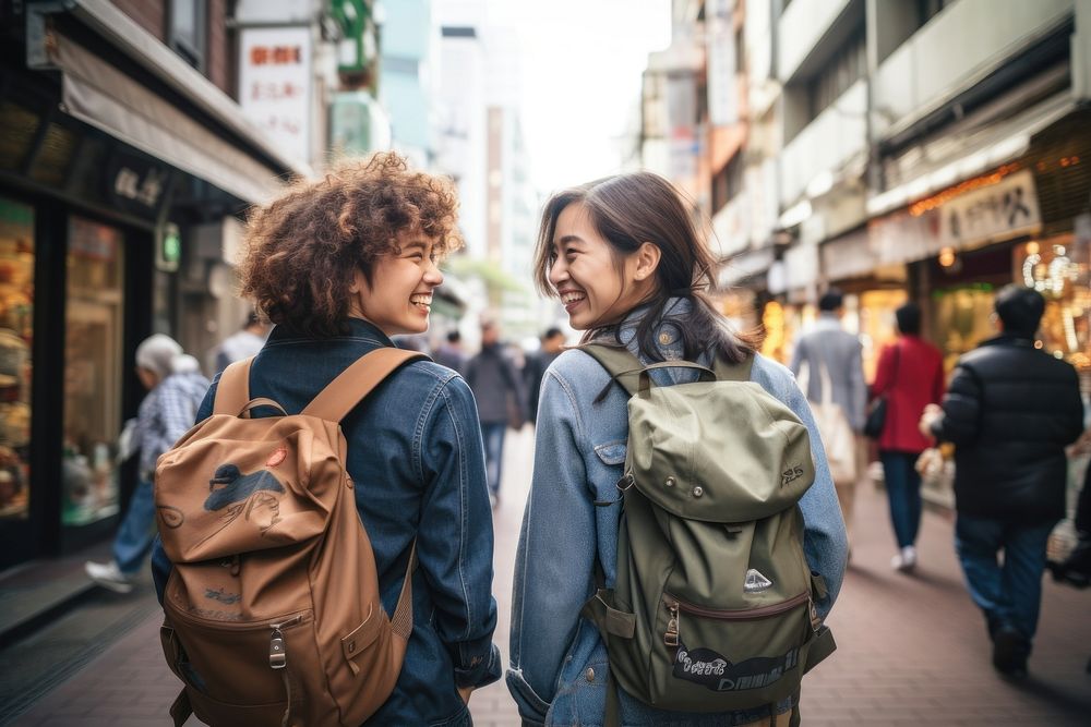 Mixed race friends travel tokyo cheerful backpack adult.