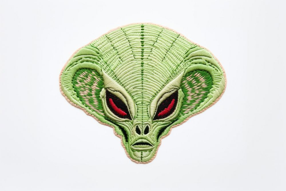 Alien in embroidery style art representation accessories.