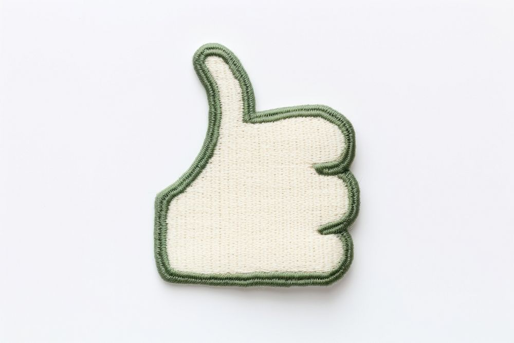 Thumb up icon in embroidery style pattern gesturing pointing.