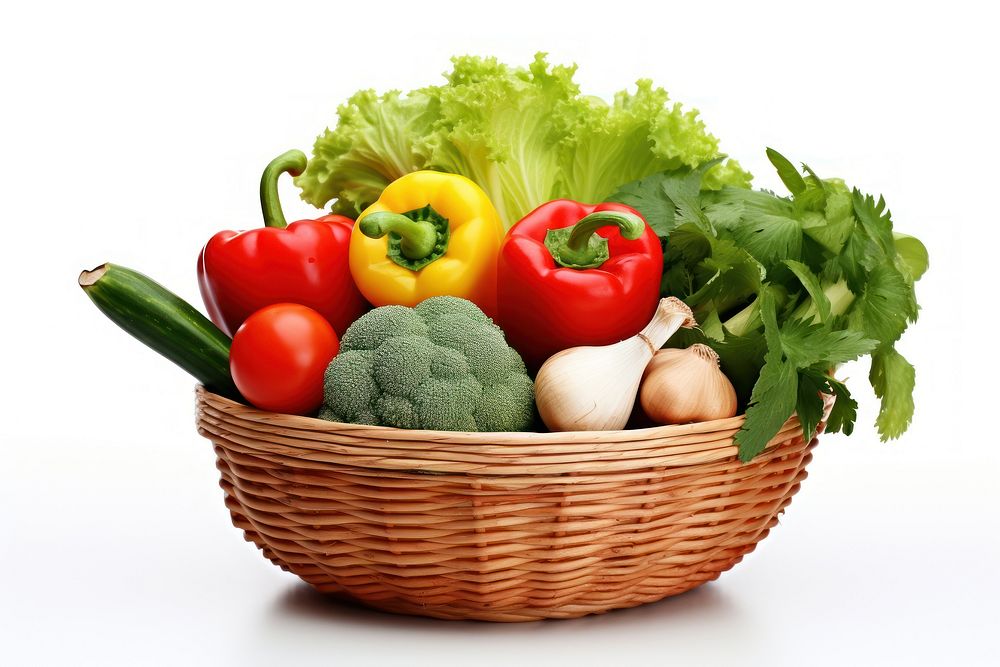 Vegetables in the small basket plant food white background.