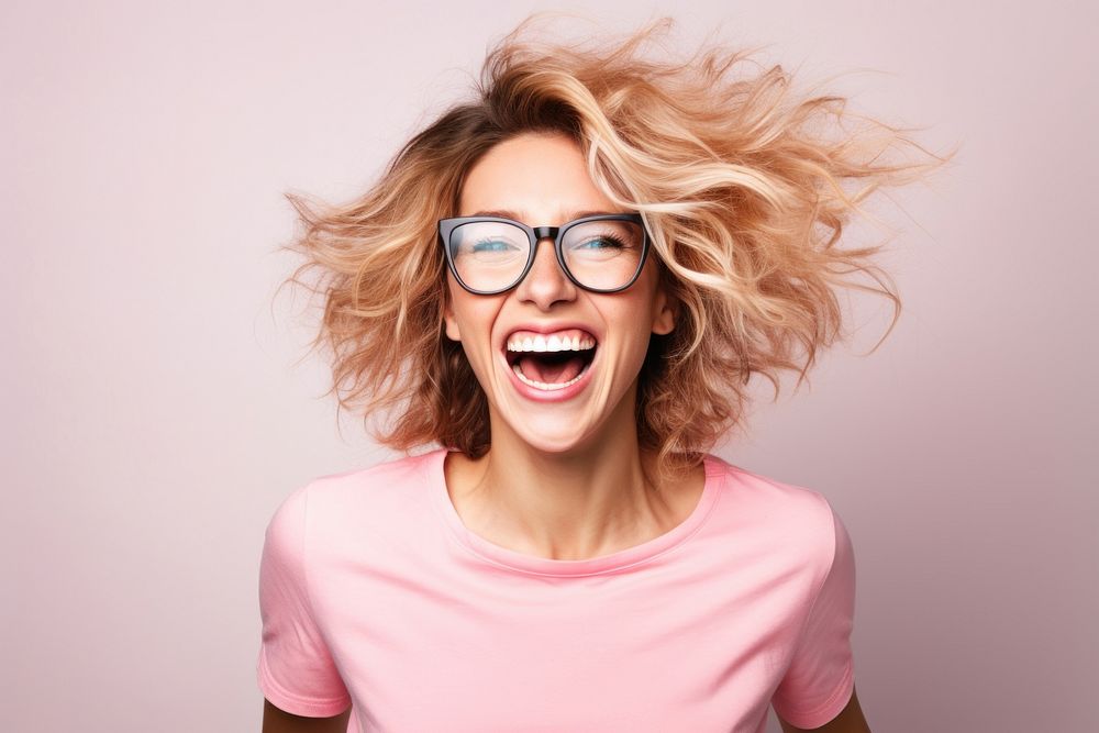 Very happy young woman shouting laughing glasses.