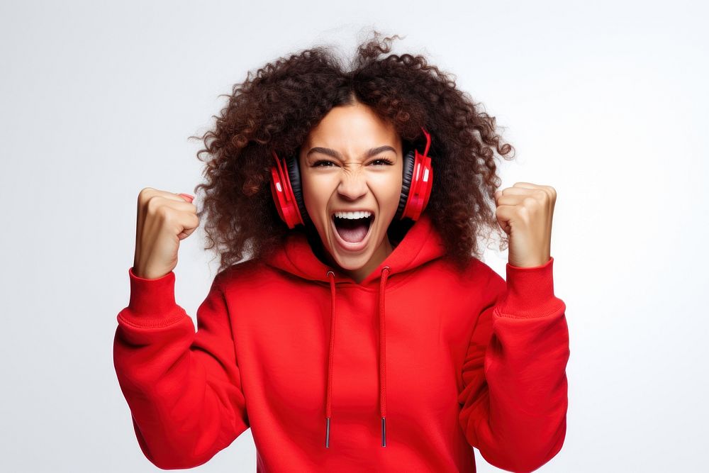 Happy Young black woman headphones sweatshirt shouting.