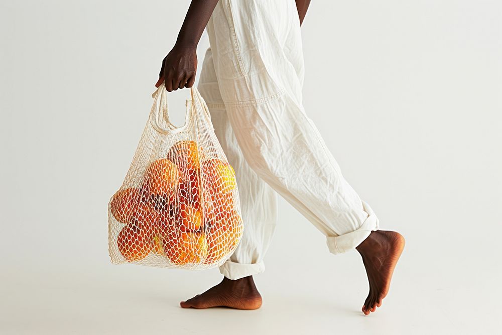 African american walking bag carrying handbag.