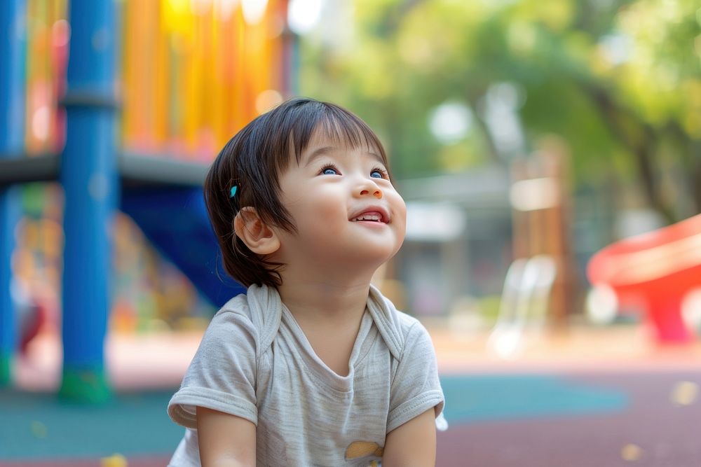 Asian toddler playground cheerful portrait.