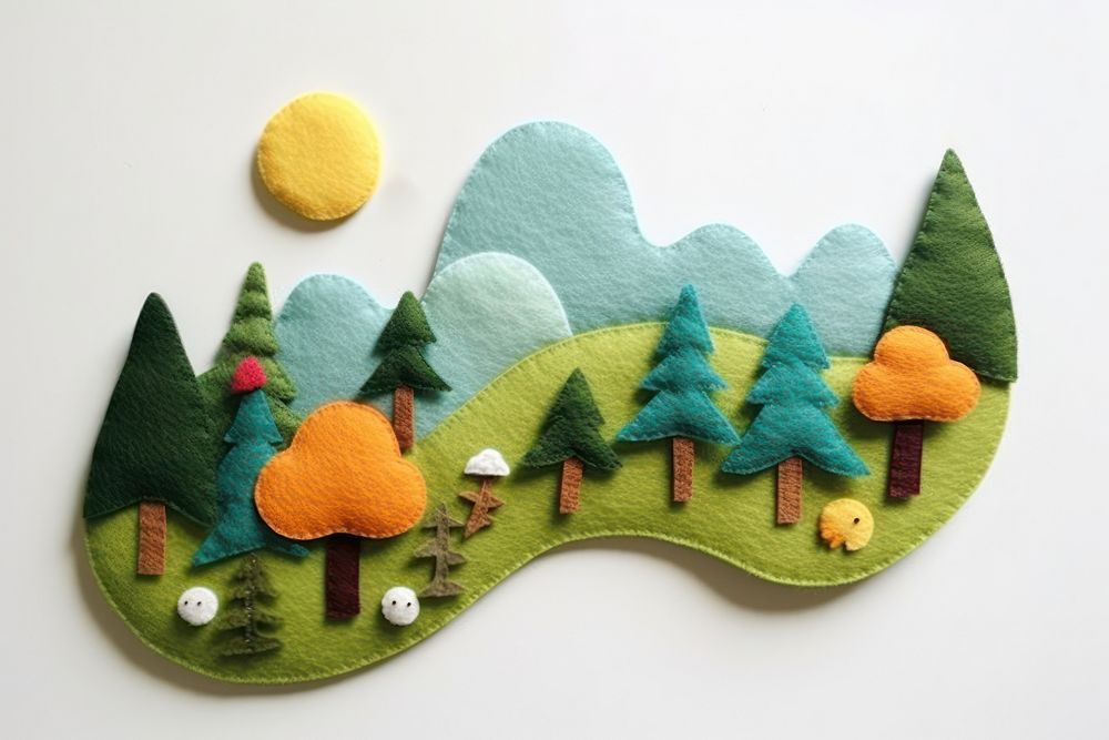 Photo of felt forest on hill textile craft art.