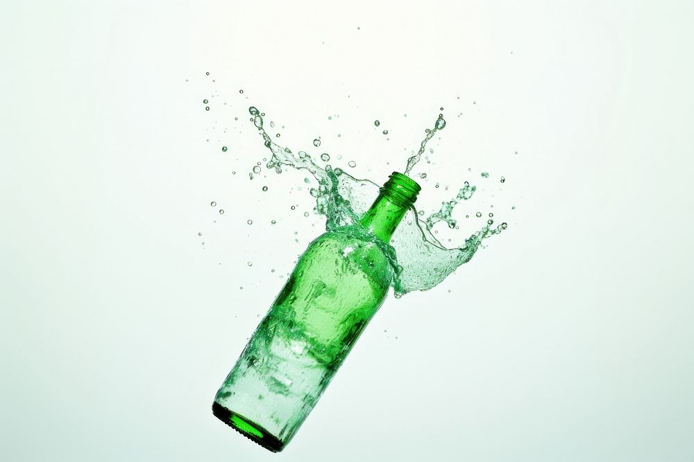 Green bottle with splash glass drink white background.