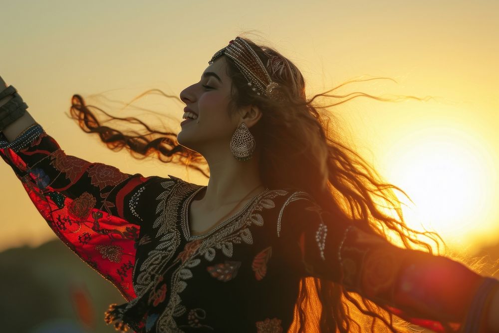 Middle Eastern girl dancing sunset adult performance.